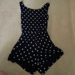 Navy blue polka dot romper with crisscross back